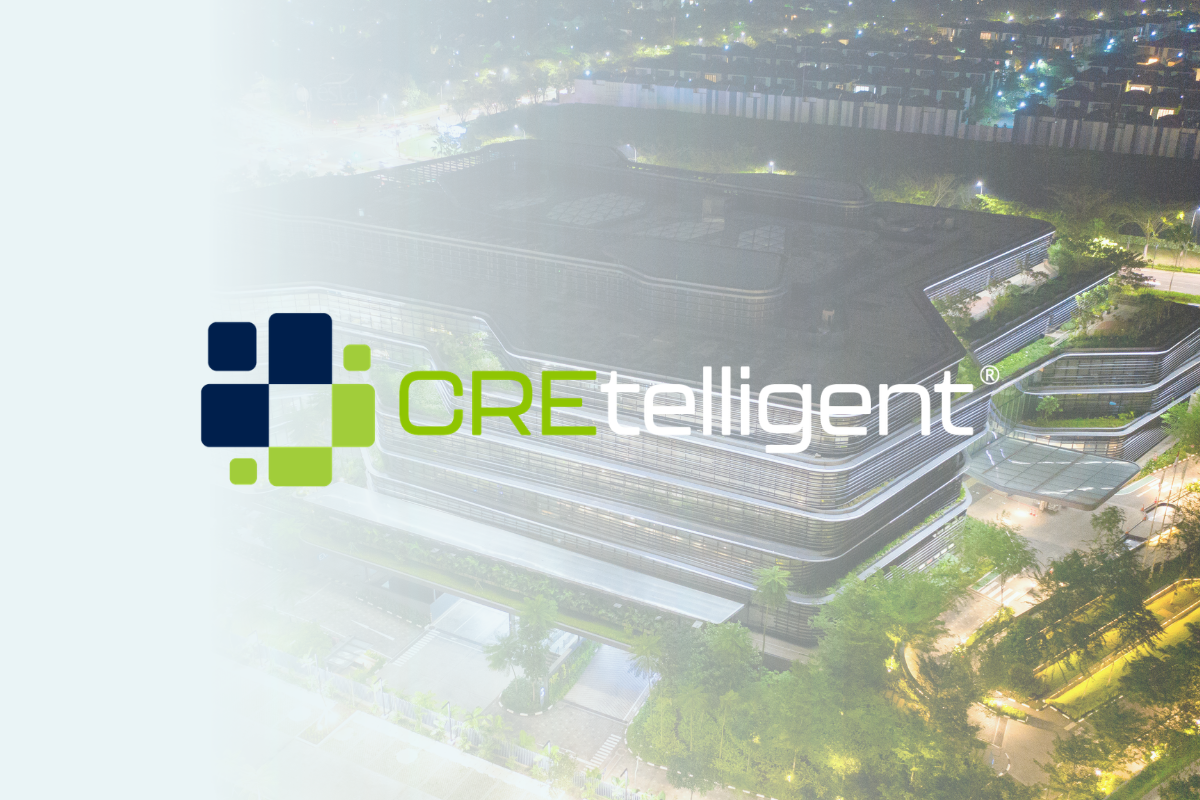 Commercial building overlaid with CREtelligent logo