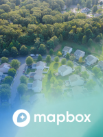 Mapbox logo overlaying aerial image of town