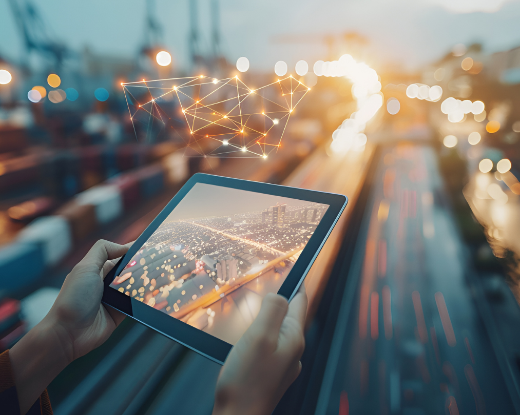 Person holding tablet screen with roads in the background