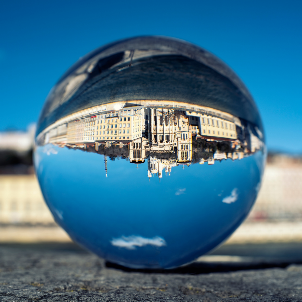 Transparent ball mirroring building